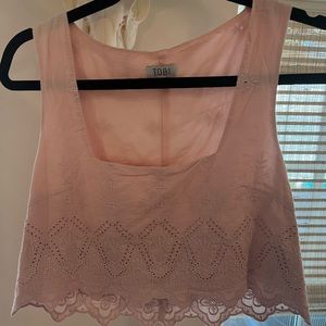 Cute summer cropped tank with floral detail! Never worn